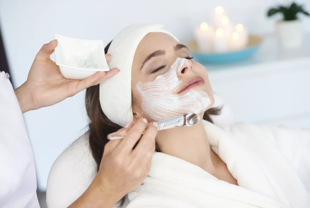 Beautiful woman getting beauty treatment by Whimsy Aesthetic Clinic